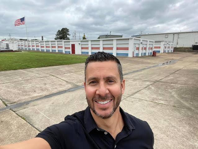Alex Pardo standing in front of one of his self-storage facilities